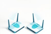 Two wireless routers side by side emitting Wi-Fi signal waves