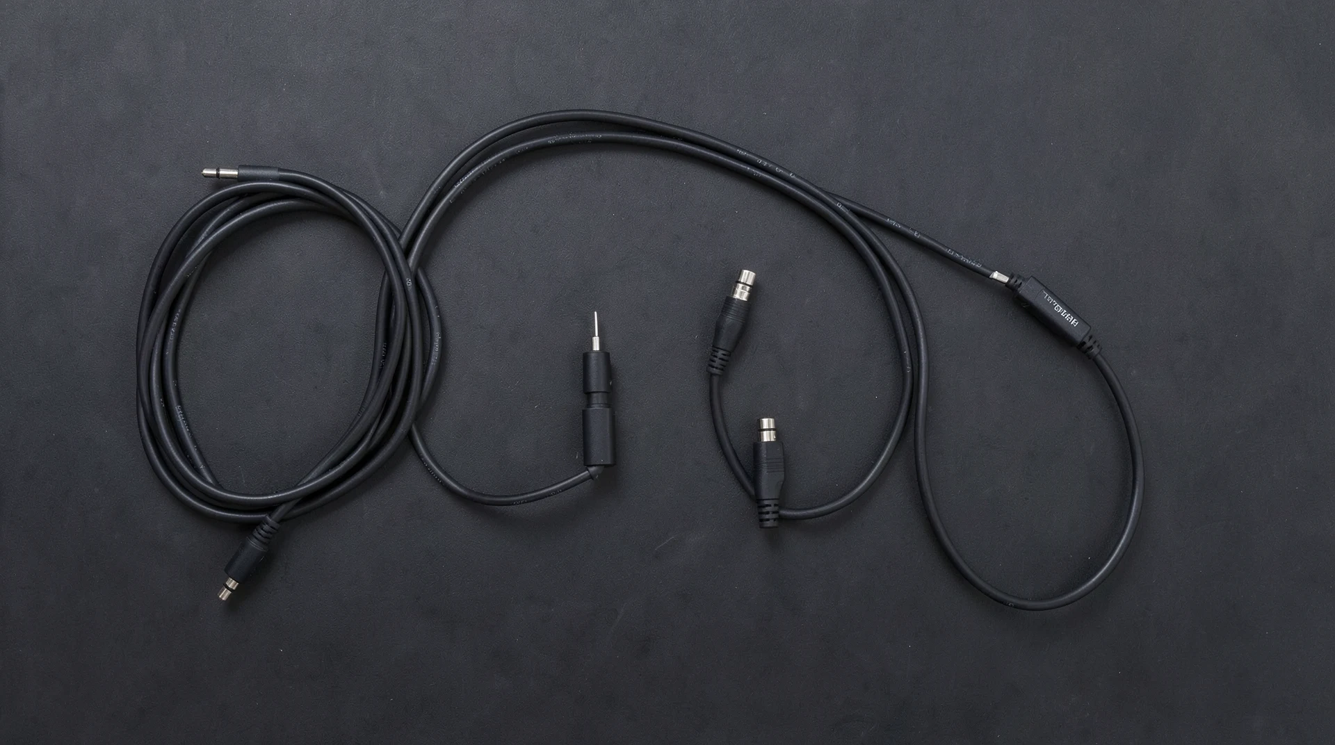 Digital audio cables on dark surface
