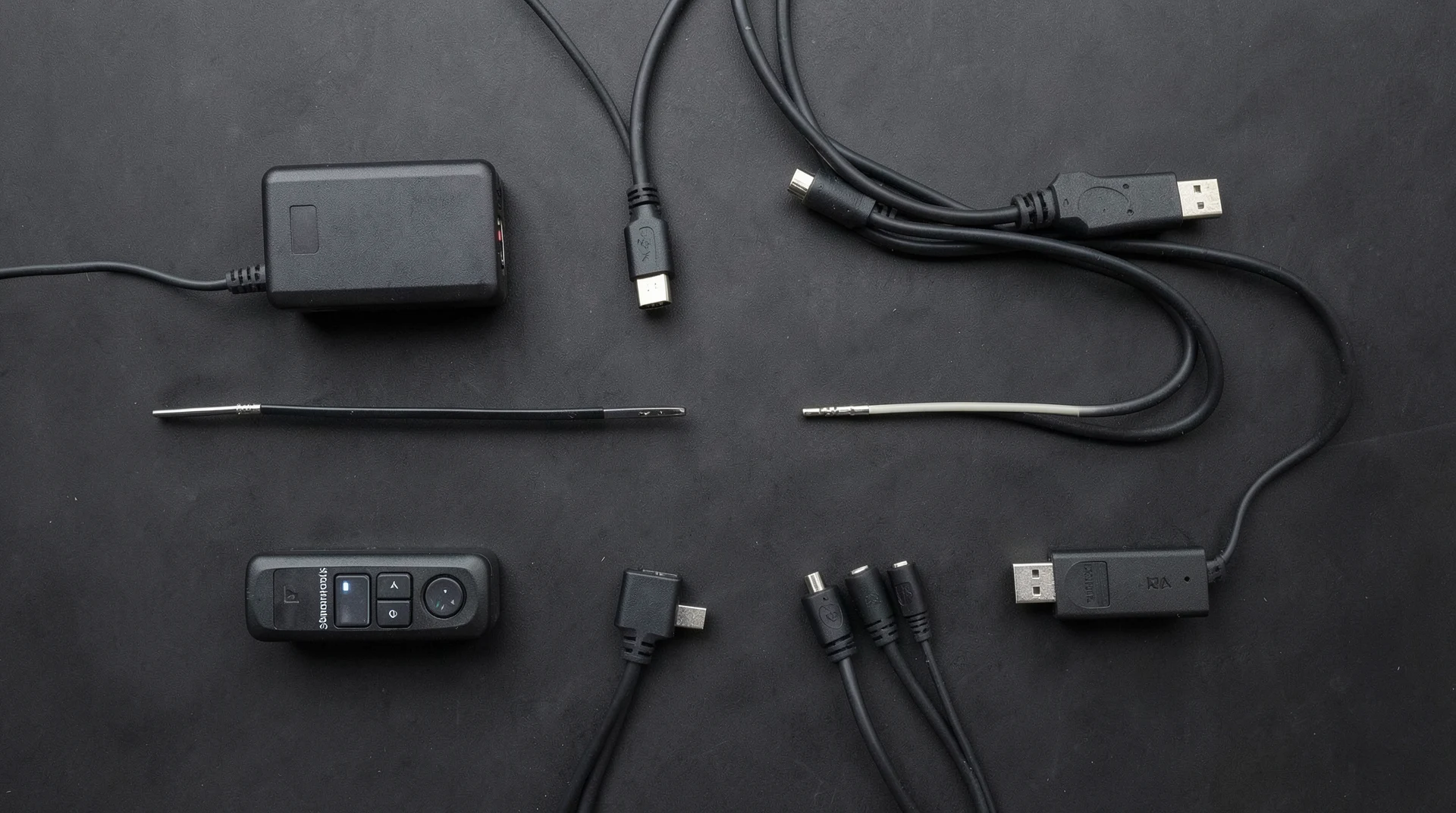 Various video cables on dark surface